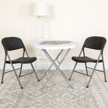 Load image into Gallery viewer, HERCULES Series 330 lb. Capacity Black Plastic Folding Chair with Charcoal Frame