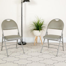 Load image into Gallery viewer, HERCULES Series Ultra-Premium Triple Braced Gray Vinyl Metal Folding Chair with Easy-Carry Handle