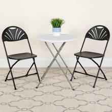 Load image into Gallery viewer, HERCULES Series 650 lb. Capacity Black Plastic Fan Back Folding Chair