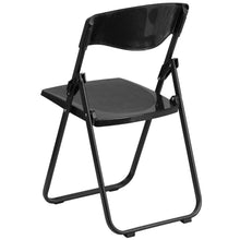 Load image into Gallery viewer, HERCULES Series 500 lb. Capacity Heavy Duty Black Plastic Folding Chair with Built-in Ganging Brackets
