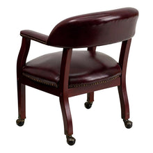 Load image into Gallery viewer, Oxblood Vinyl Luxurious Conference Chair with Accent Nail Trim and Casters