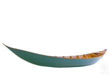 Load image into Gallery viewer, A flat-bottomed teal-colored sampan boat with a wooden structure and a paddle.