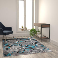 Load image into Gallery viewer, 5' x 7' Turquoise Swirl Olefin Area Rug with Jute Backing
