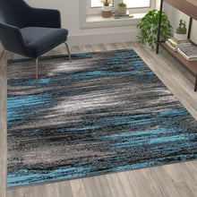 Load image into Gallery viewer, 5' x 7' Blue Scraped Design Area Rug - Olefin Rug with Jute Backing
