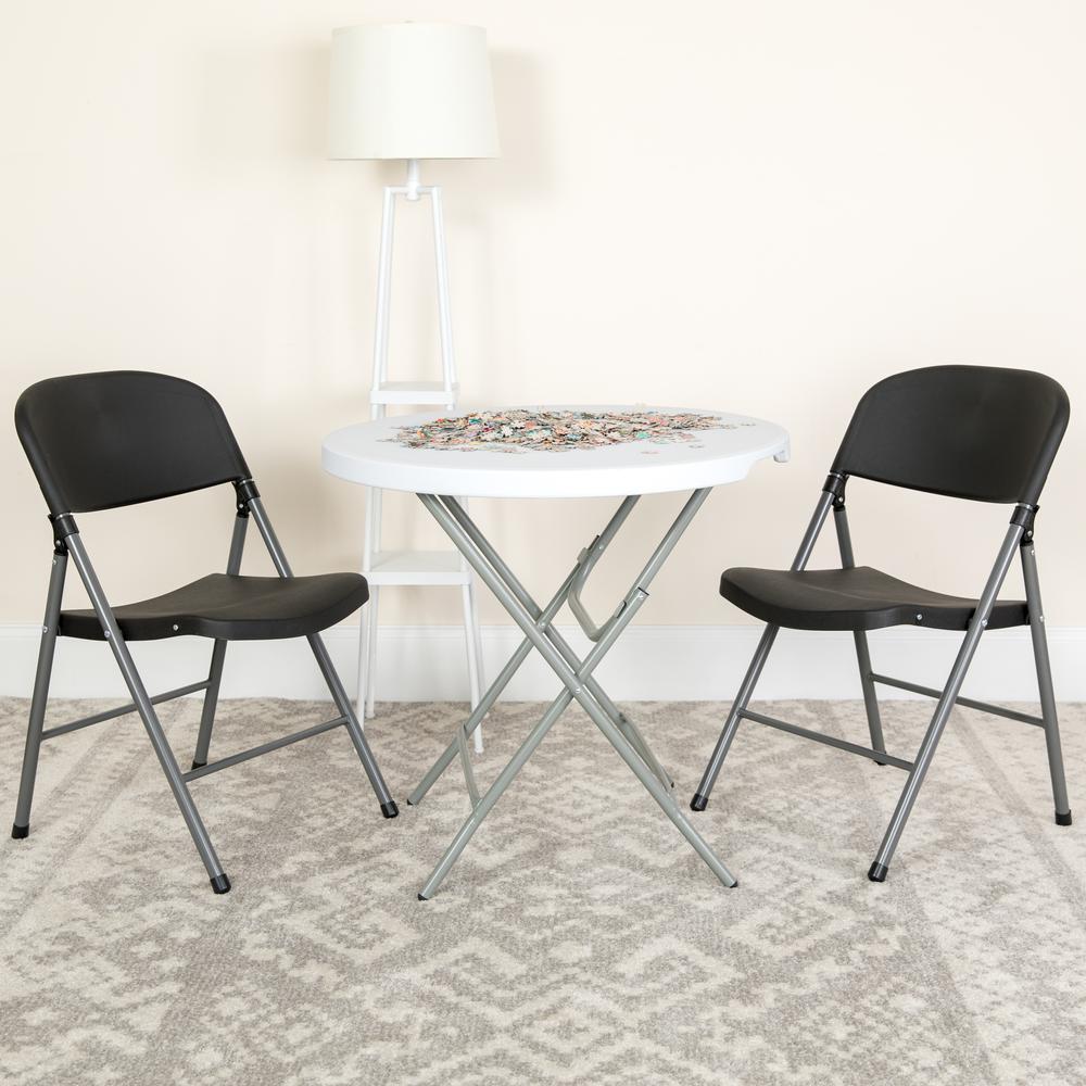 HERCULES Series 330 lb. Capacity Black Plastic Folding Chair with Charcoal Frame