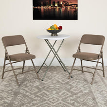 Load image into Gallery viewer, HERCULES Series Curved Triple Braced &amp; Double Hinged Beige Fabric Metal Folding Chair
