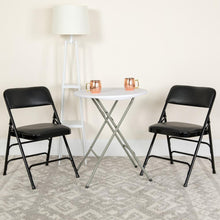 Load image into Gallery viewer, HERCULES Series Curved Triple Braced &amp; Double Hinged Black Vinyl Metal Folding Chair
