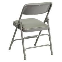 Load image into Gallery viewer, HERCULES Series Curved Triple Braced &amp; Double Hinged Gray Vinyl Metal Folding Chair
