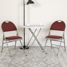 Load image into Gallery viewer, HERCULES Series Ultra-Premium Triple Braced Burgundy Fabric Metal Folding Chair with Easy-Carry Handle
