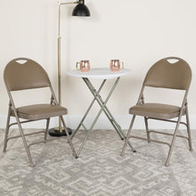 Load image into Gallery viewer, HERCULES Series Ultra-Premium Triple Braced Beige Vinyl Metal Folding Chair with Easy-Carry Handle
