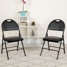 Load image into Gallery viewer, HERCULES Series Ultra-Premium Triple Braced Black Vinyl Metal Folding Chair with Easy-Carry Handle
