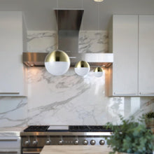 Load image into Gallery viewer, Integrated LED Height Adjustable Pendant Light with Globe Shade in Brass

