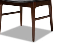 Load image into Gallery viewer, Baxton Studio Berlin Mid-Century Modern Black Faux Leather Upholstered Walnut Finished 5-Piece Wood Dining Set
